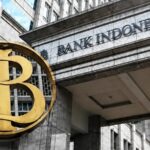 Gedung Bank Indonesia dengan logo BI di depan kantor pusat sebagai ilustrasi kebijakan suku bunga acuan dan stabilitas nilai tukar rupiah.