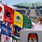 Ilustrasi bendera partai politik Indonesia dalam konteks survei elektabilitas Poltracking 2026